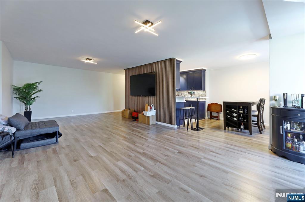 301 Beech Street, Unit 7A Hackensack, NJ 07601 - Photo 15 of 19 a living room with furniture and a flat screen tv