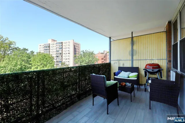 a outdoor living space with furniture and a potted plant