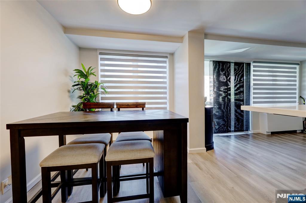 301 Beech Street, Unit 7A Hackensack, NJ 07601 - Photo 18 of 19 a view of a dining room with furniture and wooden floor