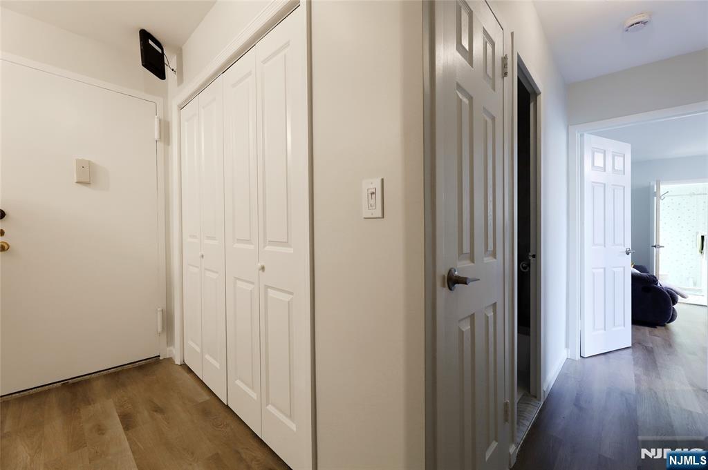 301 Beech Street, Unit 7A Hackensack, NJ 07601 - Photo 5 of 19 a view of a hallway with wooden floor