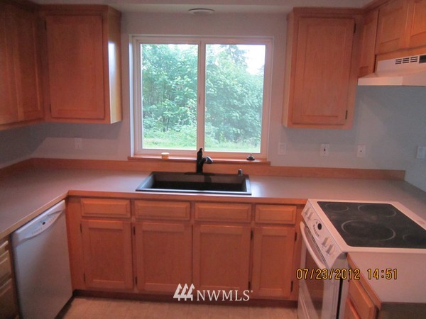 22005 Old Owen Road Monroe, WA 98272 - Photo 7 of 11 a kitchen with a sink and large window
