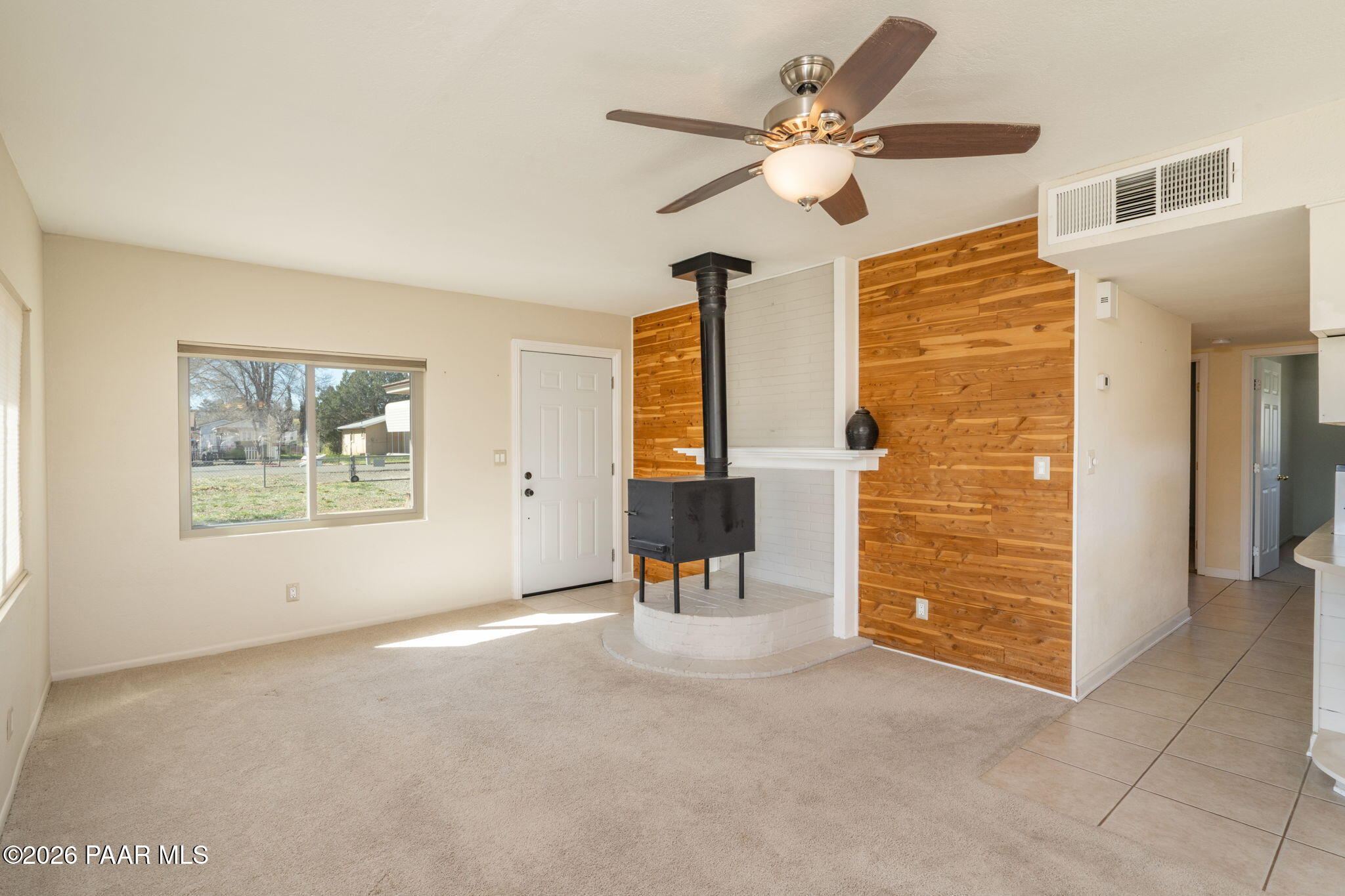 17270 East Peach Tree Road Mayer, AZ 86333 - Photo 3 of 31 an empty room with windows and ceiling fan
