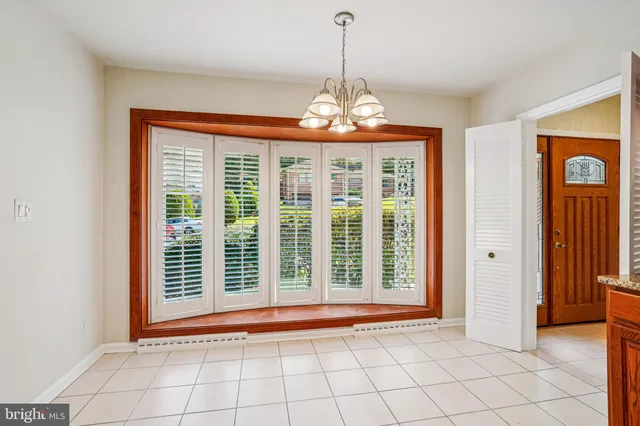 a bed room with a bed and a chair