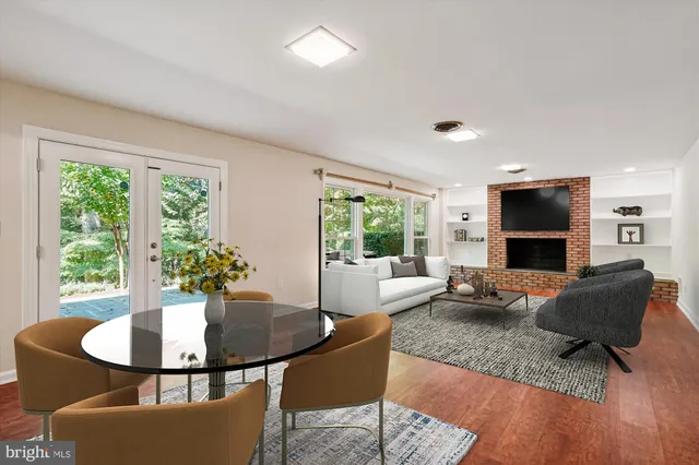 a spacious bedroom with a bed and glass window