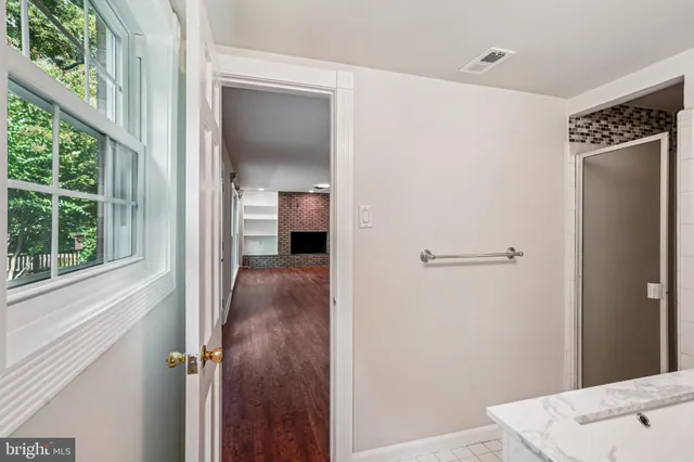a kitchen with stainless steel appliances a refrigerator and microwave