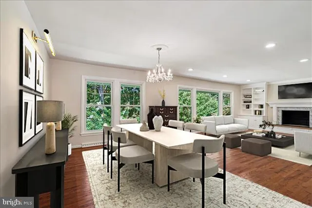 a view of a livingroom with furniture window and wooden floor
