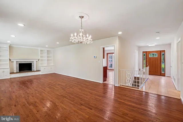 a view of livingroom with hardwood floor and kitchen view