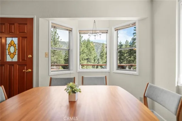 a large kitchen with kitchen island a large counter top space a sink stainless steel appliances and cabinets