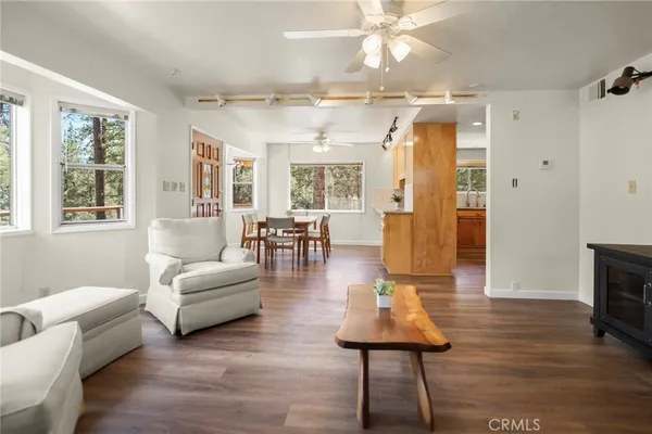 a view of a dining room with furniture window and wooden floor