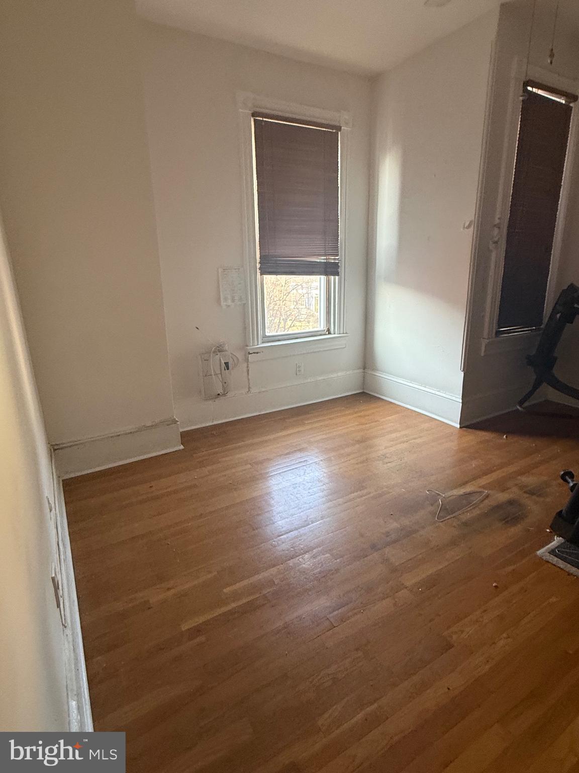 656 6th Street Northeast Washington, DC 20002 - Photo 11 of 30 an empty room with wooden floor and windows
