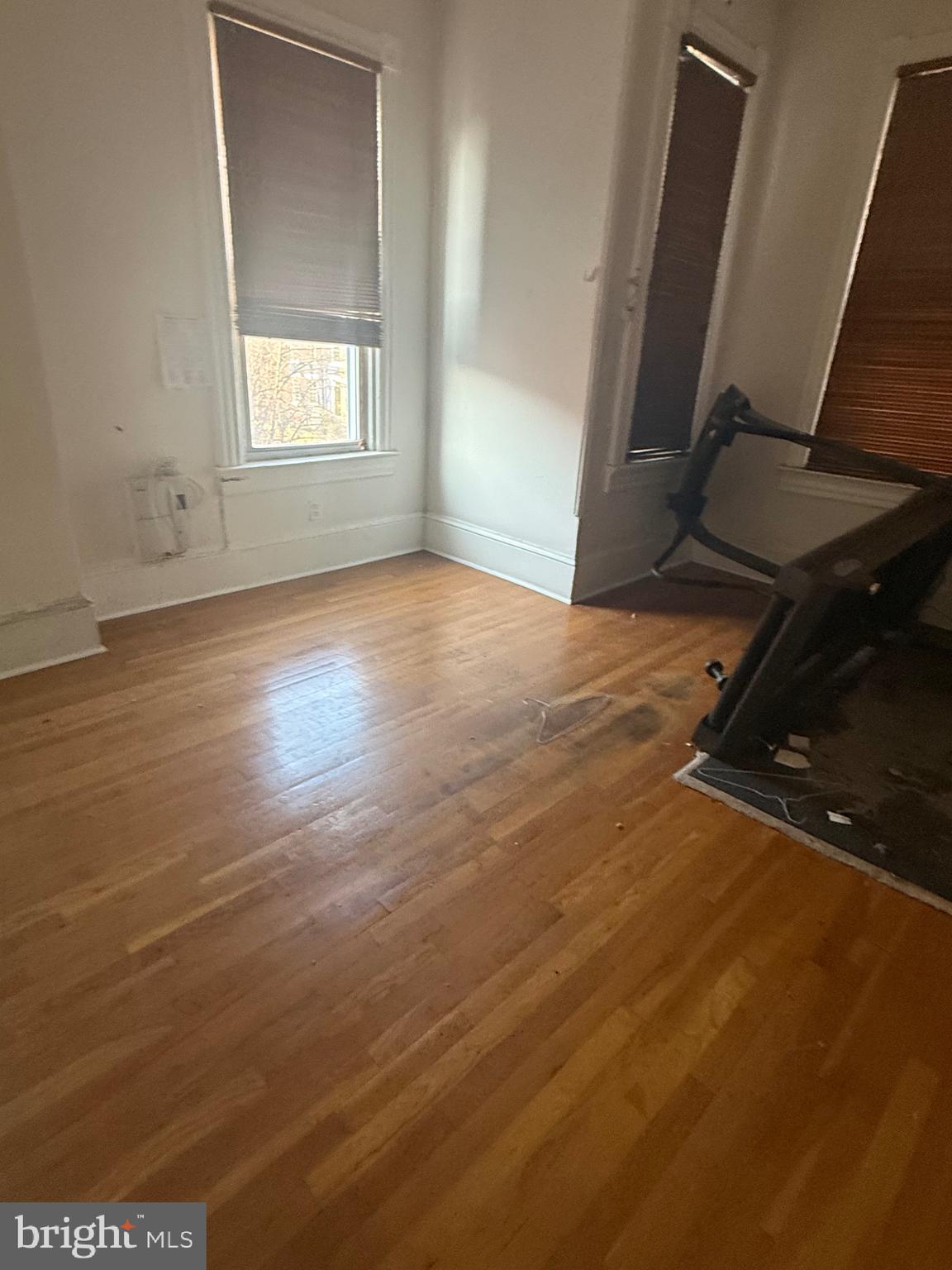 656 6th Street Northeast Washington, DC 20002 - Photo 13 of 30 an empty room with wooden floor and windows