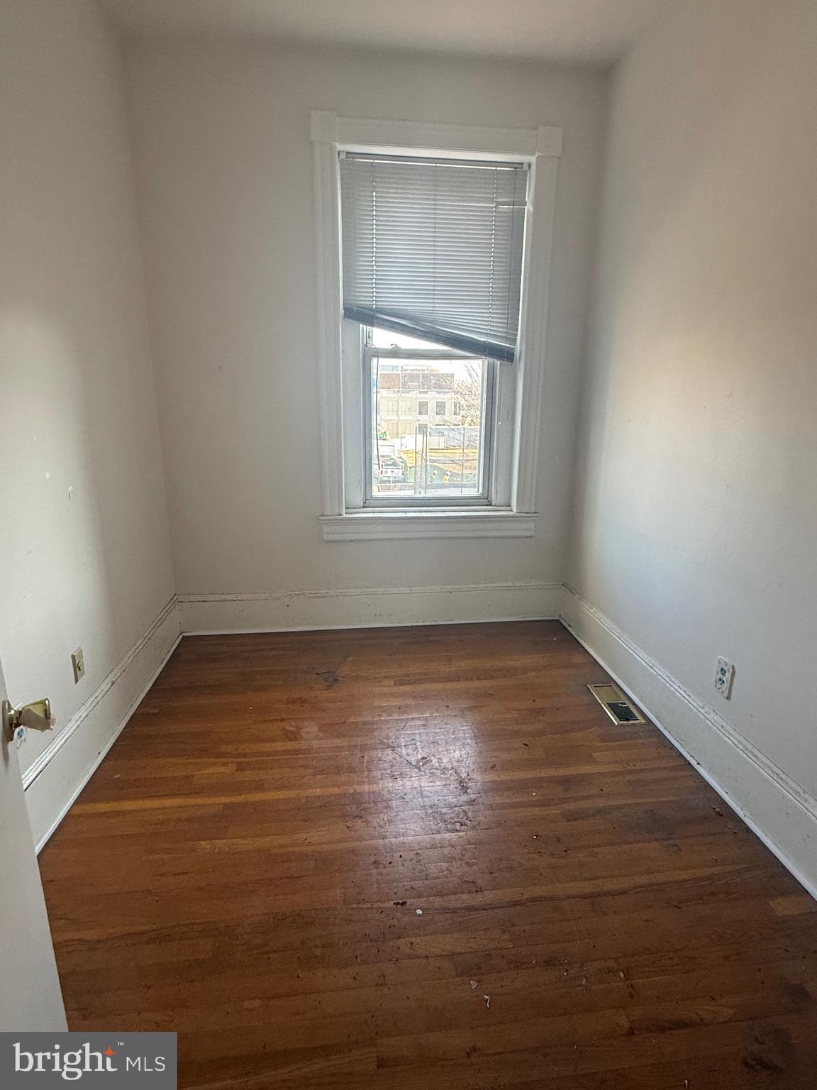656 6th Street Northeast Washington, DC 20002 - Photo 23 of 30 an empty room with wooden floor and windows