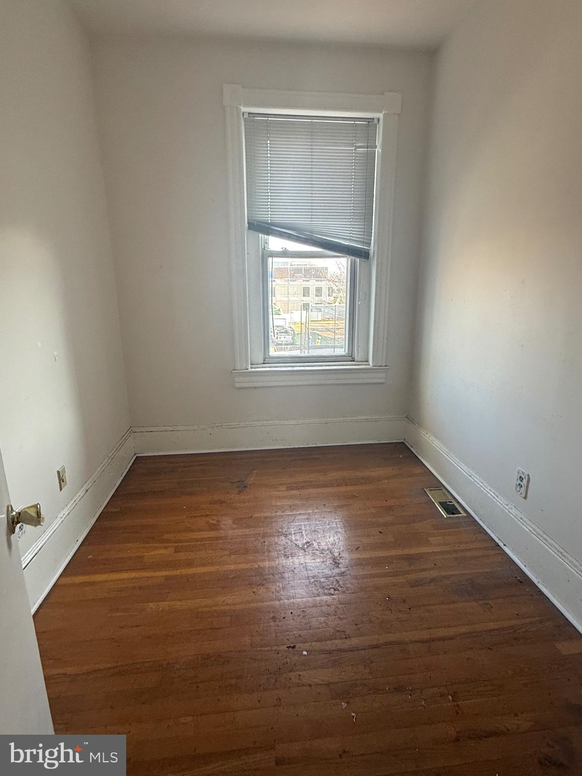 656 6th Street Northeast Washington, DC 20002 - Photo 24 of 30 an empty room with wooden floor and windows