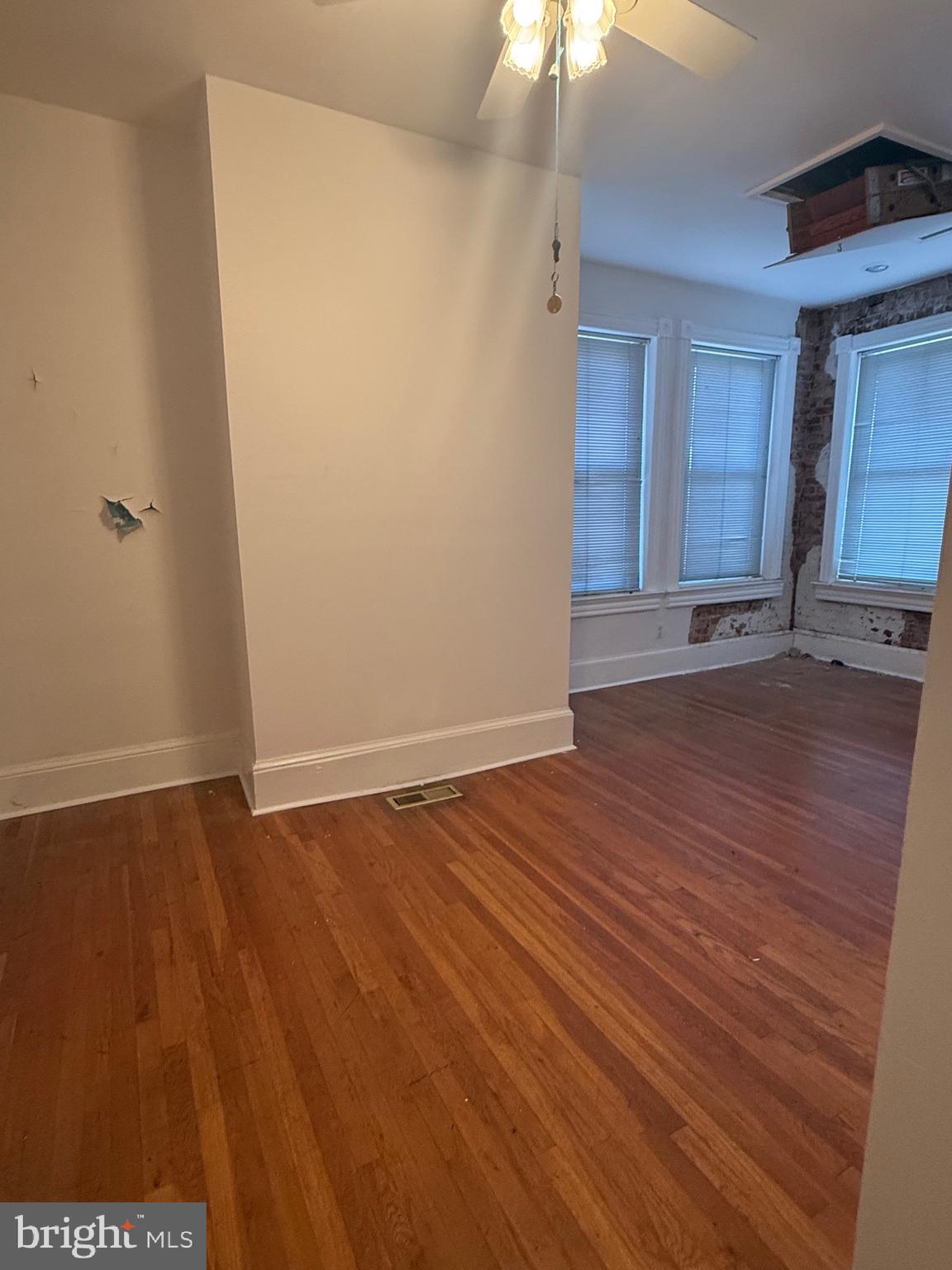 656 6th Street Northeast Washington, DC 20002 - Photo 6 of 30 a view of an empty room with wooden floor and a window