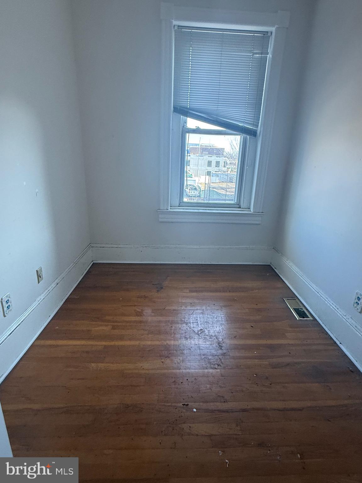 656 6th Street Northeast Washington, DC 20002 - Photo 7 of 30 an empty room with wooden floor and windows