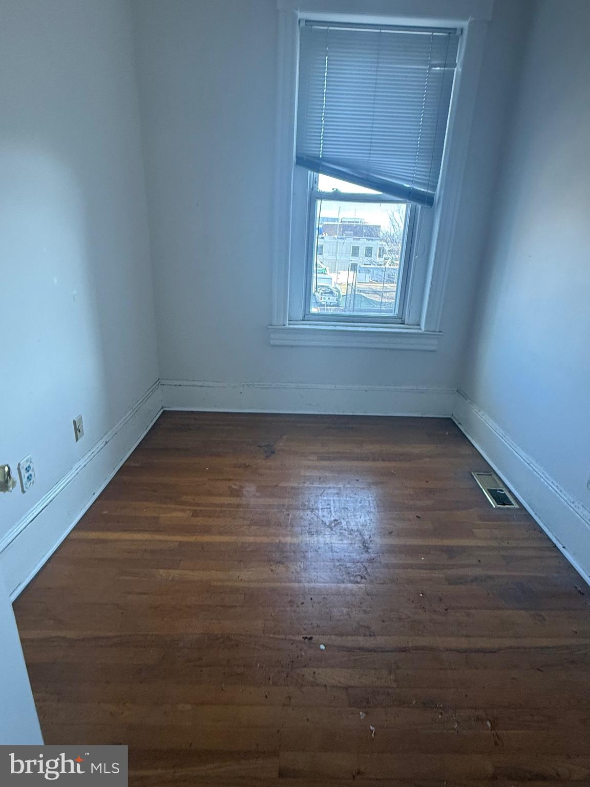 656 6th Street Northeast Washington, DC 20002 - Photo 8 of 30 an empty room with wooden floor and windows