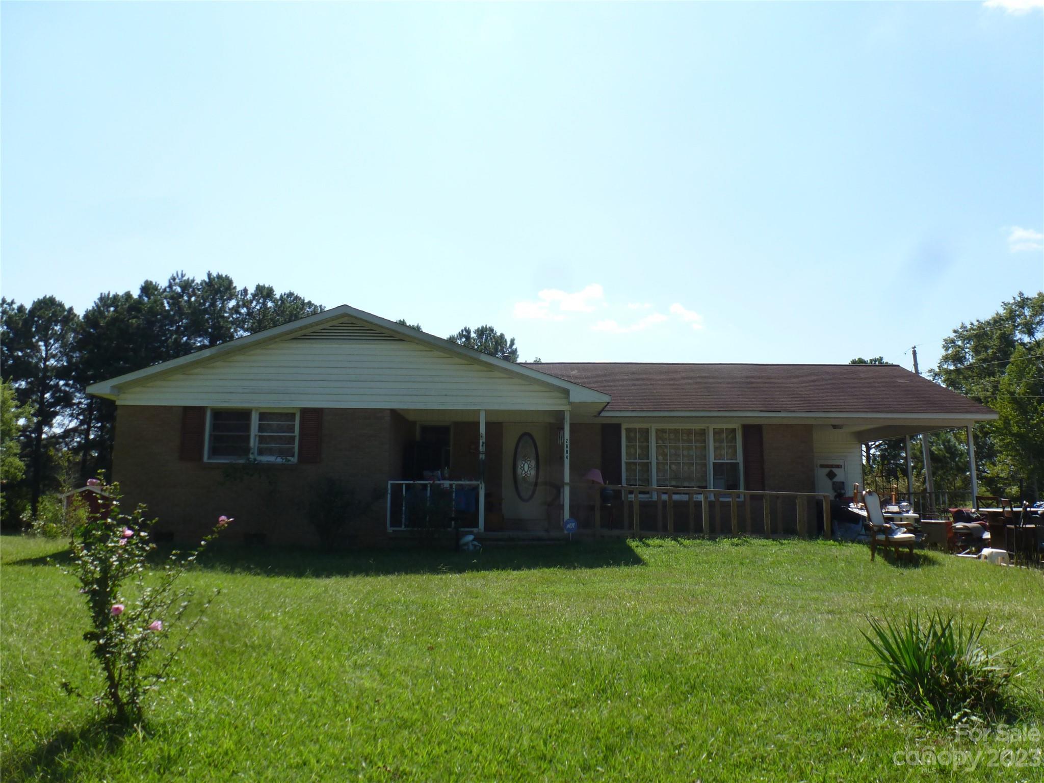 2804 Regency Road Lancaster, SC 29720 - Photo 1 of 8 a view of house with backyard space and garden