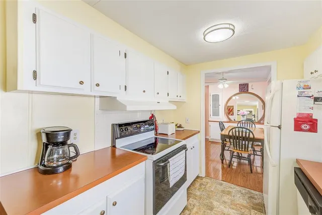 a kitchen with a sink and a stove top oven