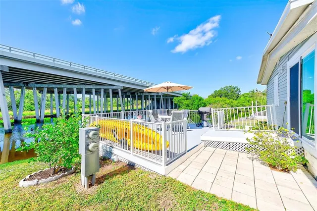 a view of a swimming pool with a deck and a floor to ceiling window