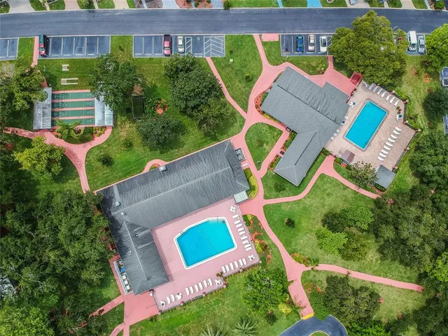 a view of a house with a yard table and chairs