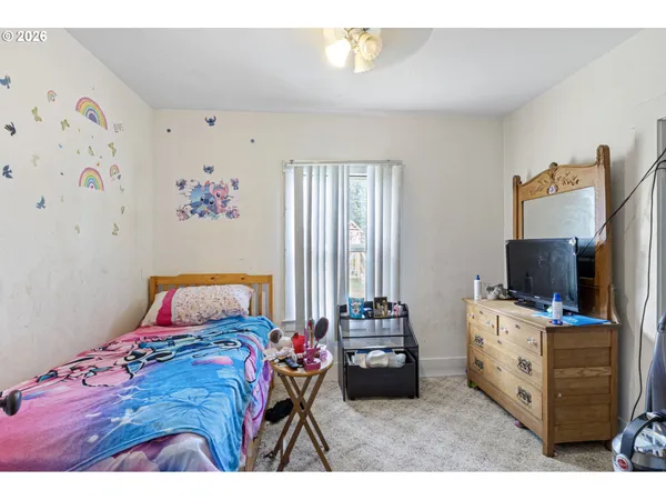 a bedroom with a bed and furniture