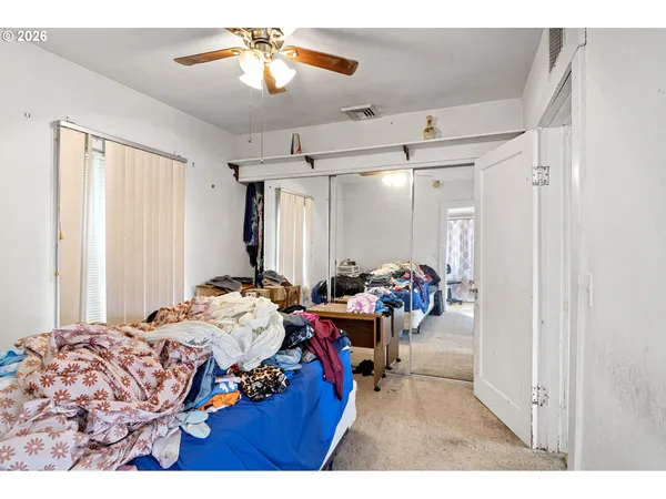 a bed room with a bed and a chandelier