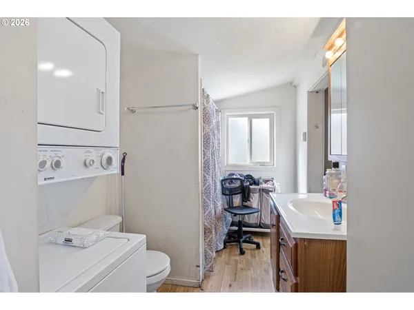 a bathroom with a sink toilet and a mirror