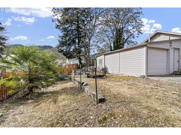 a backyard of a house with lots of green space