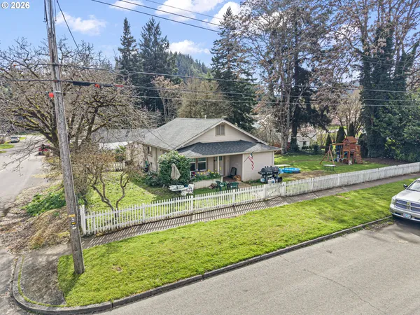 a view of a garden with a bench in the patio