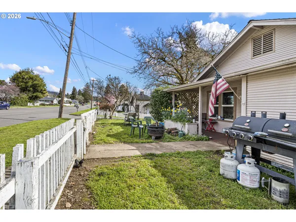 a view of an house with backyard porch and sitting area