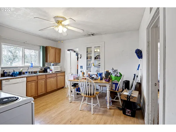 a living room with furniture and kitchen view