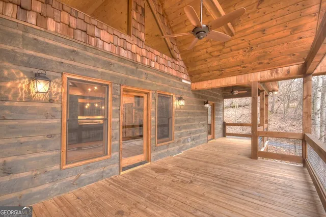 a house with a small yard and large trees