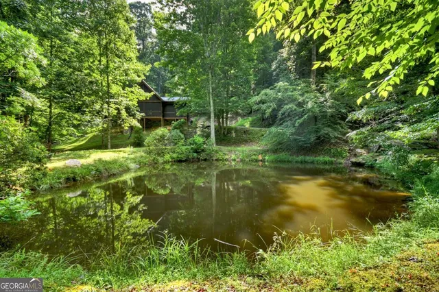 a kitchen with stainless steel appliances granite countertop a refrigerator a stove and a sink