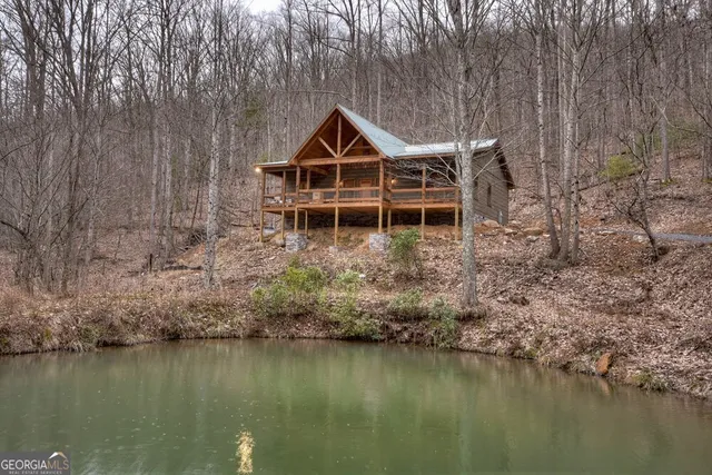 a view of a wooden deck with a yard
