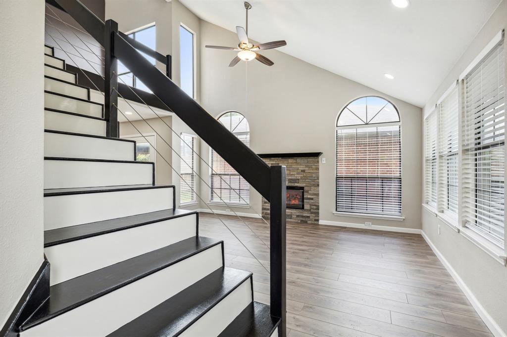 a view of entryway with wooden floor and stairs