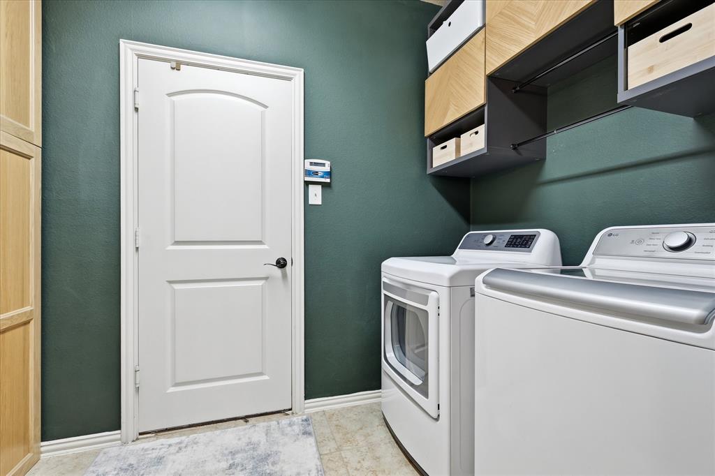7105 Edwards Road Denton, TX 76208 - Photo 19 of 40 Laundry room with custom built-in storage and space for full-size washer and dryer.