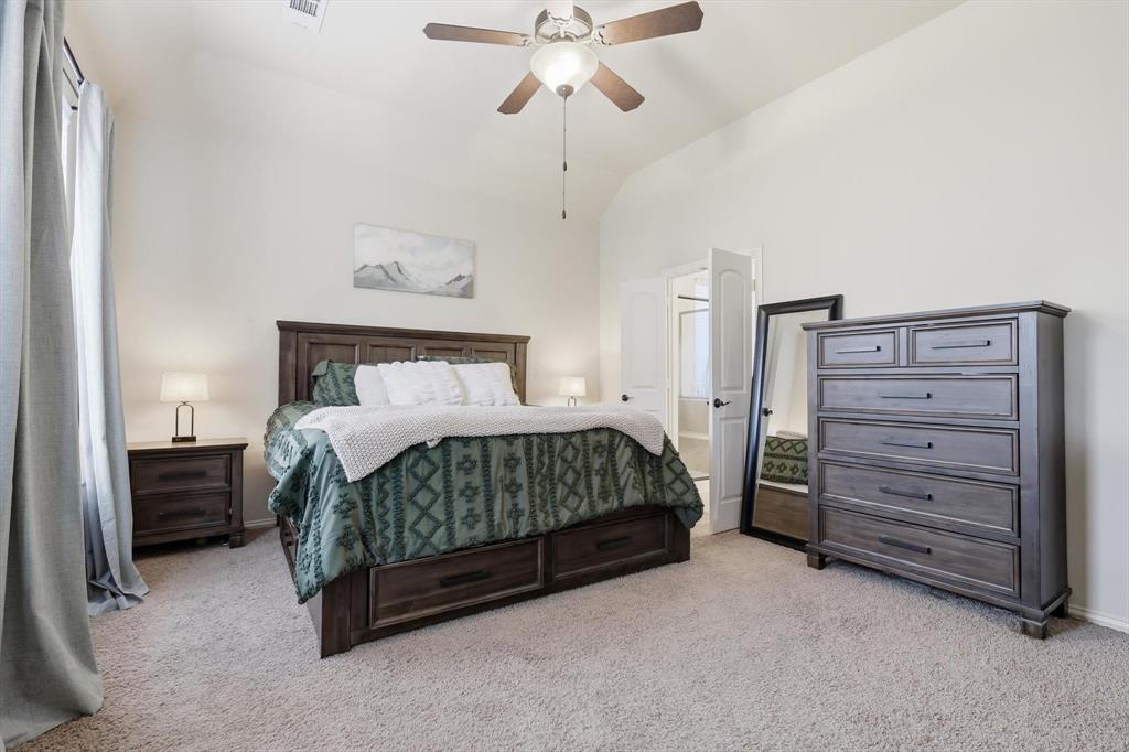 7105 Edwards Road Denton, TX 76208 - Photo 21 of 40 Spacious primary bedroom with high ceilings and natural light.