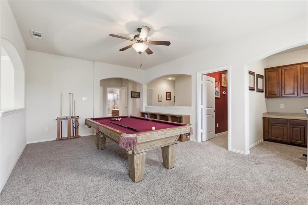 7105 Edwards Road Denton, TX 76208 - Photo 26 of 40 Spacious upstairs game room with vaulted ceilings and plenty of room to entertain. Connect to 2nd office/work space.