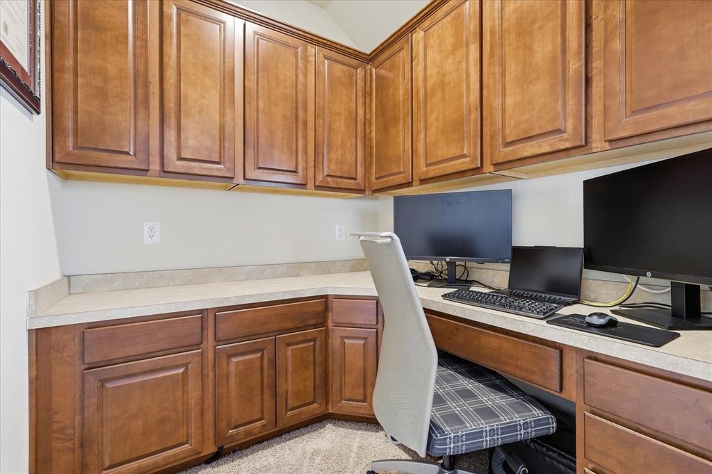 7105 Edwards Road Denton, TX 76208 - Photo 27 of 40 Dedicated workspace upstairs with built-in cabinetry and generous counter space.