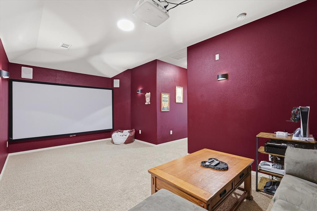 7105 Edwards Road Denton, TX 76208 - Photo 28 of 40 Private media room with projector and screen—perfect for movie nights.