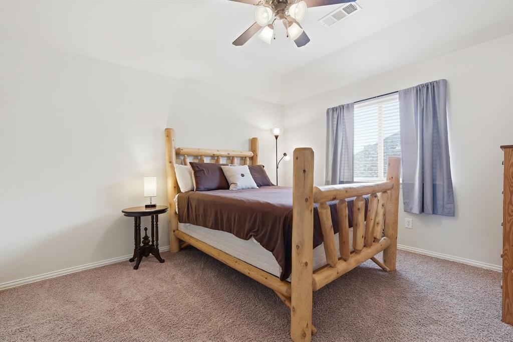 7105 Edwards Road Denton, TX 76208 - Photo 31 of 40 Spacious bedroom with ceiling fan and room for full furnishings.