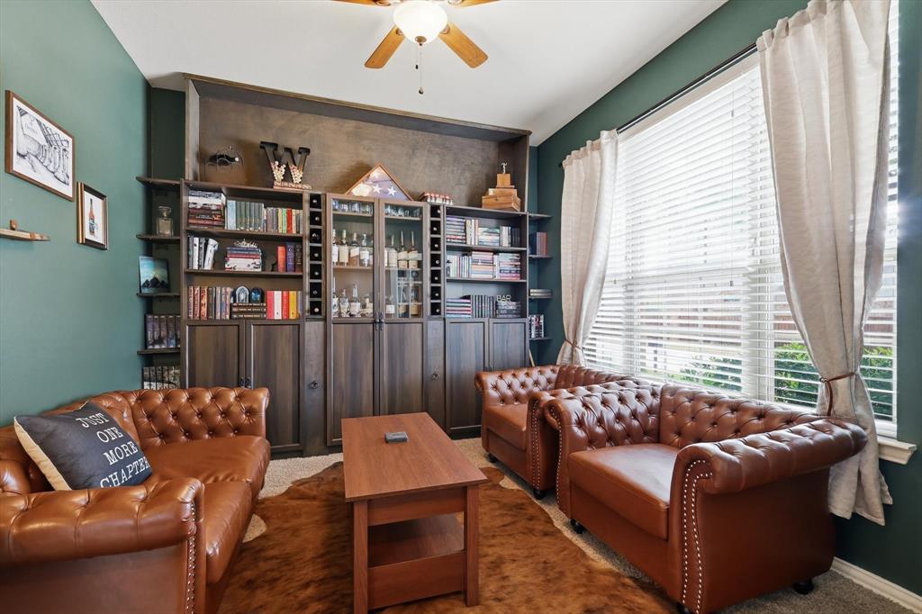 7105 Edwards Road Denton, TX 76208 - Photo 7 of 40 Versatile front room with natural light—ideal for a home office or sitting area.