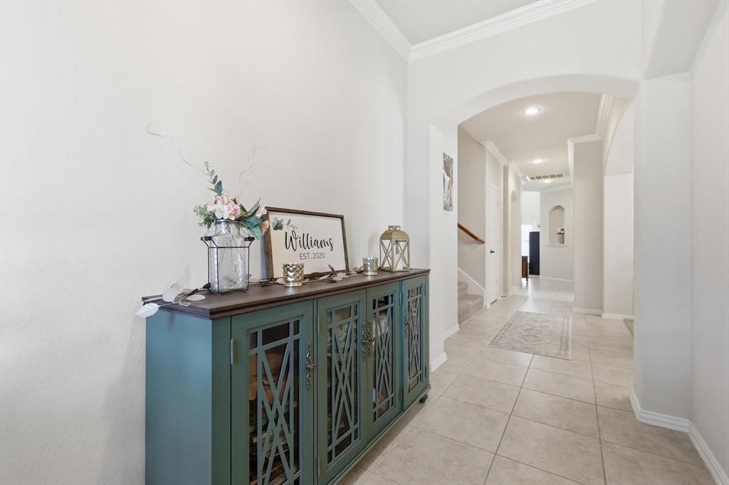 7105 Edwards Road Denton, TX 76208 - Photo 9 of 40 Spacious hallway with high ceilings and open flow to the main living areas.