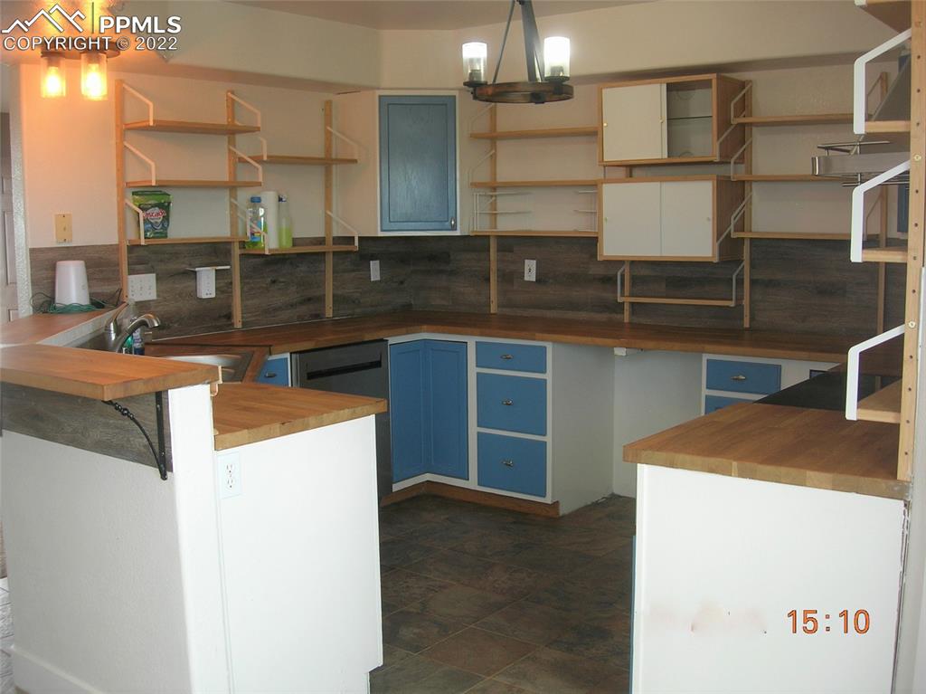 29750 Big Springs Road Calhan, CO 80808 - Photo 7 of 15 a kitchen that has a sink and a stove