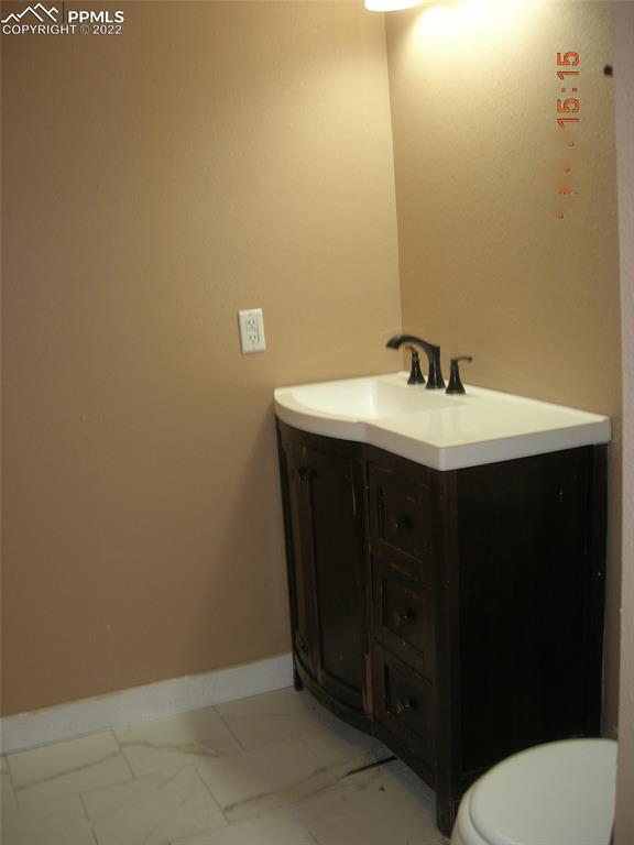 29750 Big Springs Road Calhan, CO 80808 - Photo 10 of 15 a bathroom with a sink and a toilet