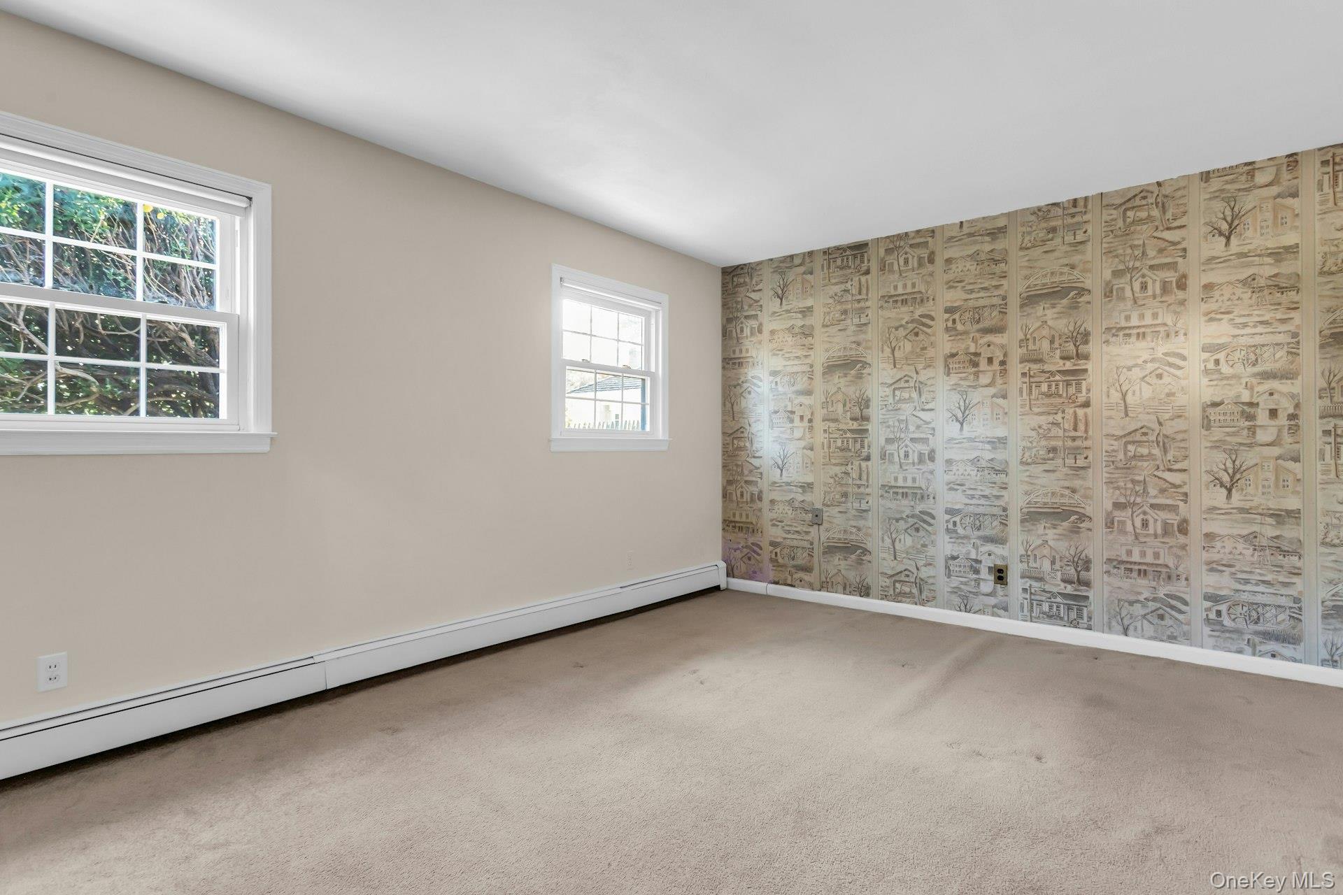 12 Violet Road Bayville, NY 11709 - Photo 22 of 42 Unfurnished room with baseboard heating and carpet