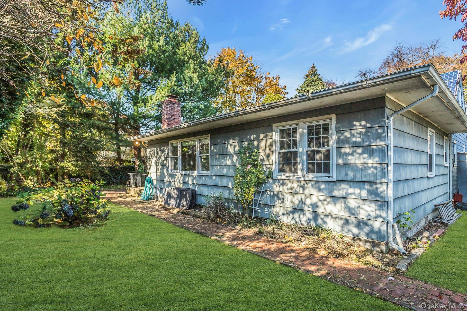 12 Violet Road Bayville, NY 11709 - Photo 39 of 42 View of side of home with a yard and a chimney