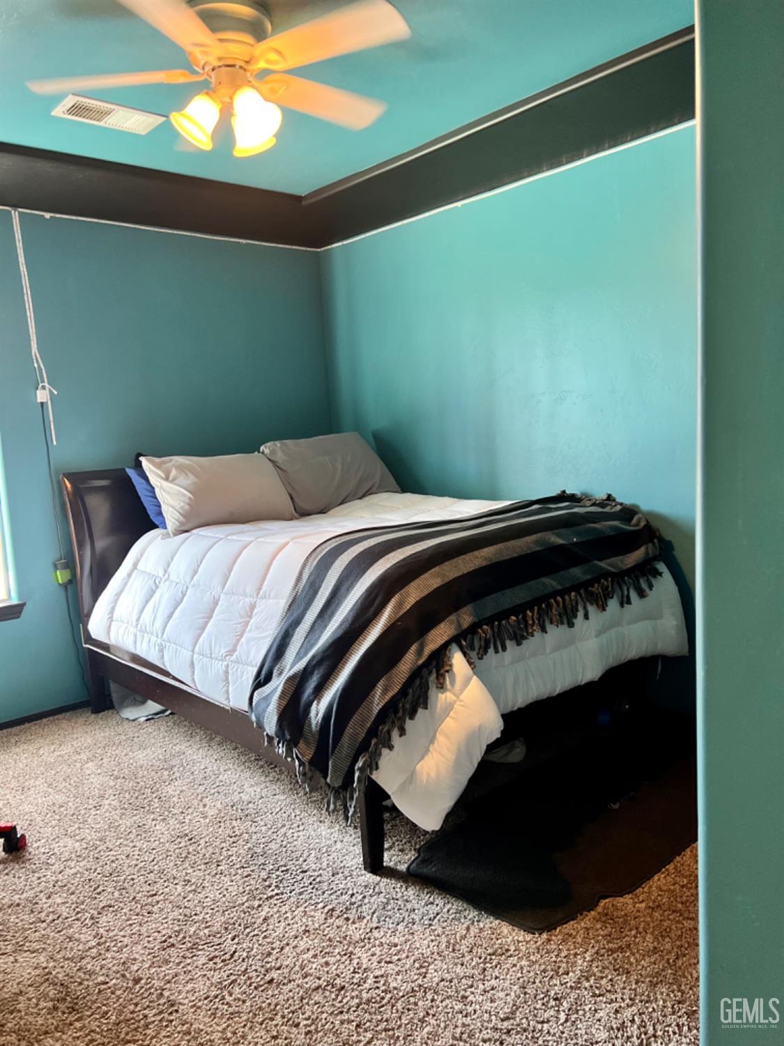 Undisclosed Address Bakersfield, CA 93308 - Photo 19 of 21 a bedroom with a bed and a window