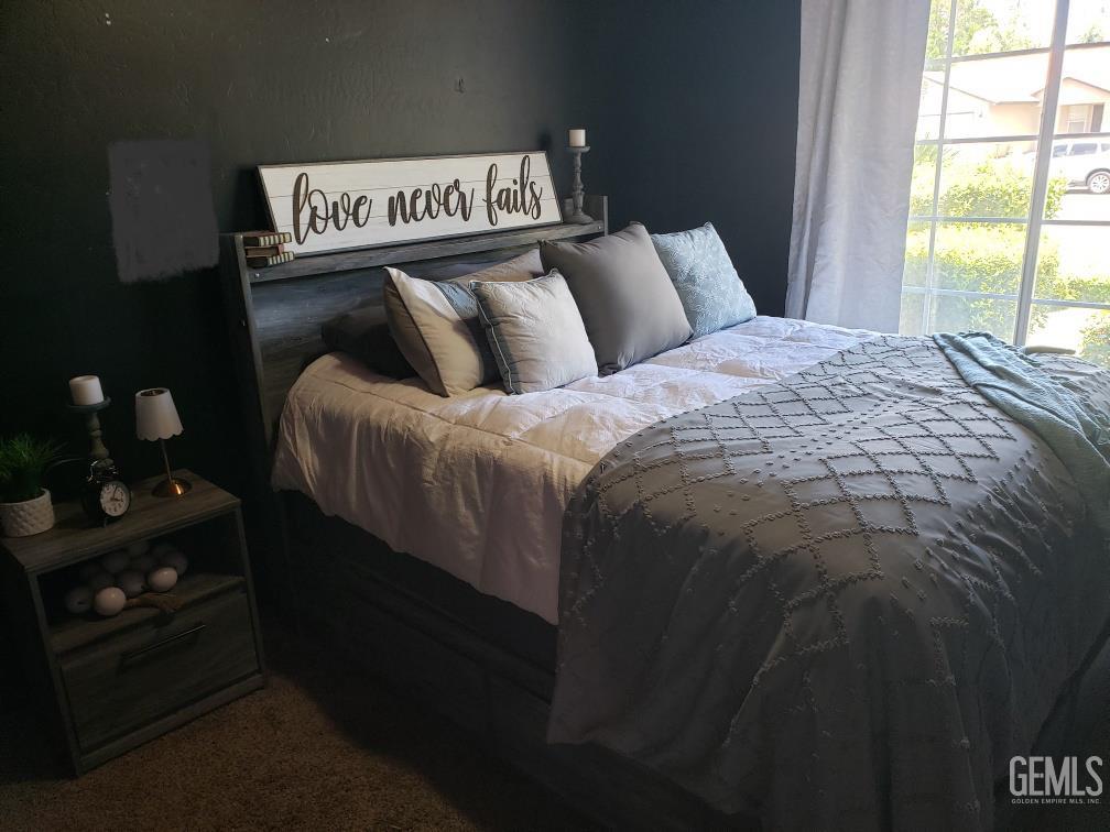 Undisclosed Address Bakersfield, CA 93308 - Photo 21 of 21 a bed sitting in a bedroom next to a window