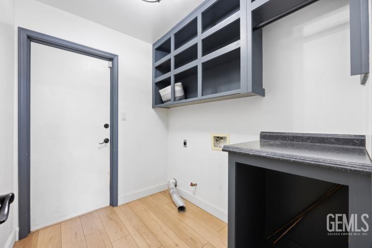 Undisclosed Address Bakersfield, CA 93308 - Photo 8 of 21 a bathroom with a sink and a mirror